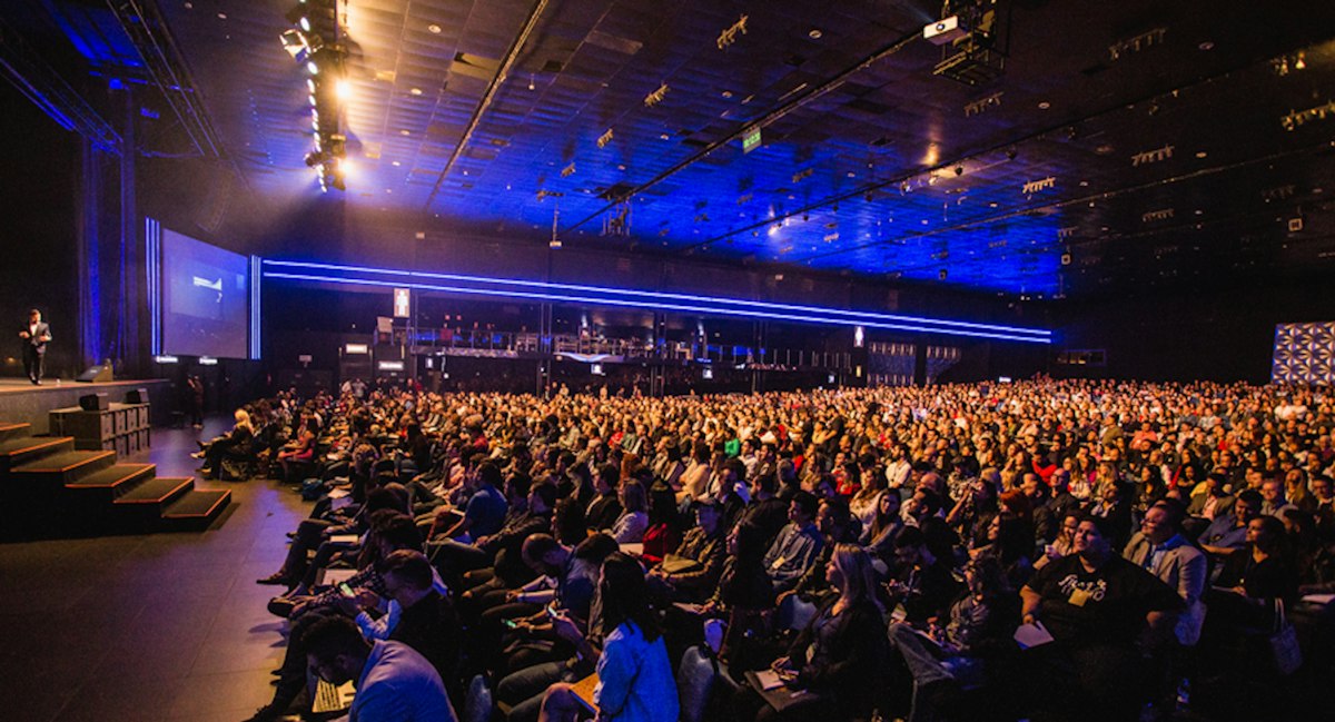 A conference hall with a large presentation screen
